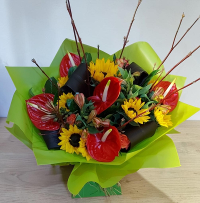 Tropical Heatwave Bouquet - A beautiful bouquet of sunflowers, Anthuriums  and other hot coloured flowers to compliment